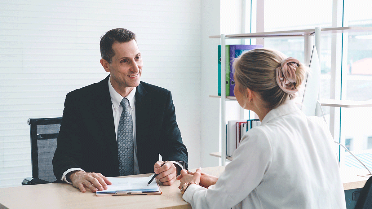 a woman negotiates her salary with her employer