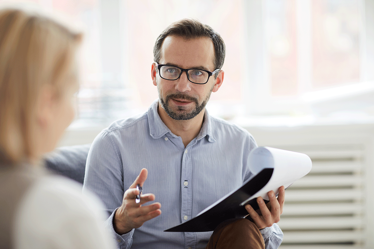 a crisis worker meets with a client who needs help