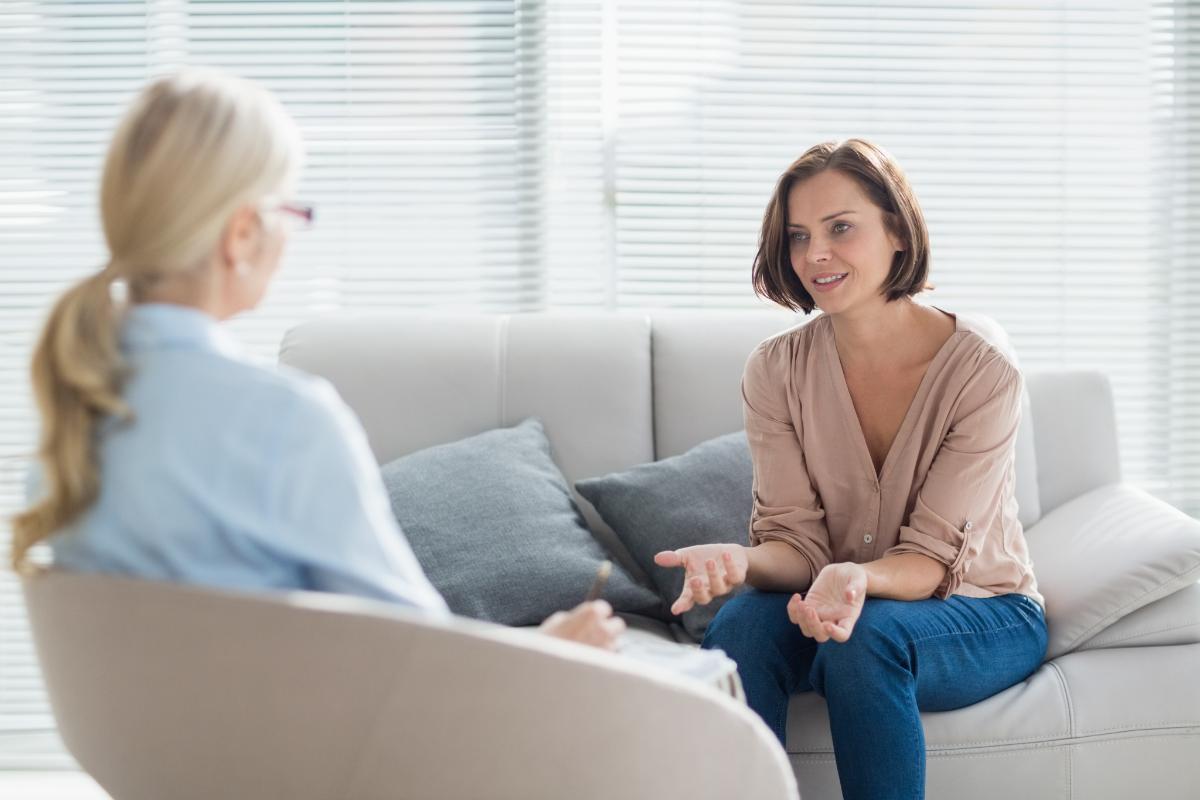 a woman works with a client as a behavioral health counselor in massachusetts